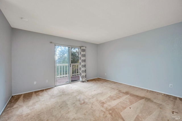 unfurnished room with carpet flooring