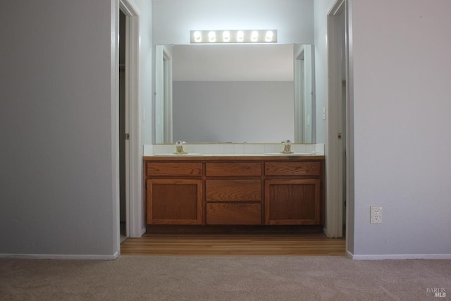19207 Ravenhill Rd, Hidden Valley Lake, CA 95467 - bathroom with a sink, baseboards, and double vanity