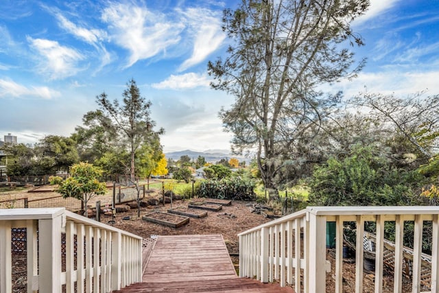 19207 Ravenhill Rd, Hidden Valley Lake, CA 95467 - wooden deck with a garden, fence, and a mountain view