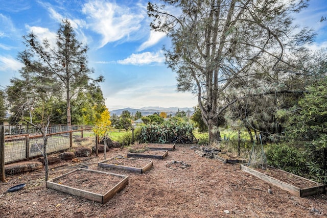 19207 Ravenhill Rd, Hidden Valley Lake, CA 95467 - view of yard featuring a garden, fence, and a mountain view