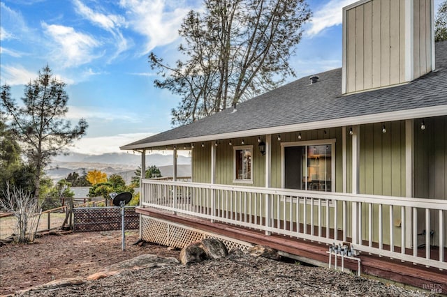 back of property with a mountain view