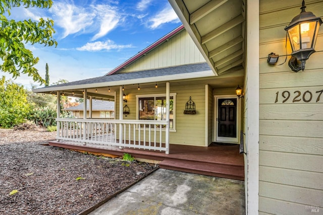 doorway to property featuring covered porch