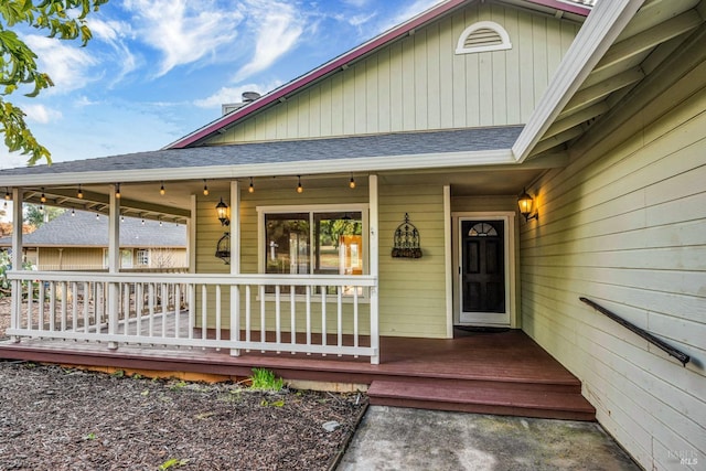 19207 Ravenhill Rd, Hidden Valley Lake, CA 95467 - view of exterior entry with covered porch and a shingled roof