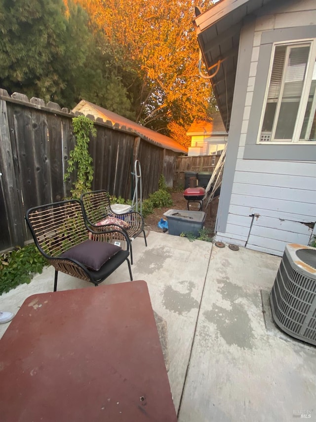 view of patio featuring fence and central air condition unit