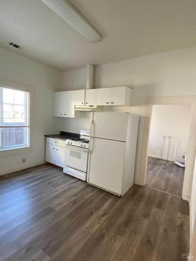 kitchen featuring white cabinets, dark hardwood / wood-style flooring, and white appliances