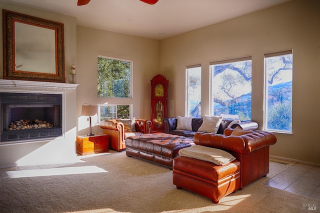 carpeted living room featuring ceiling fan