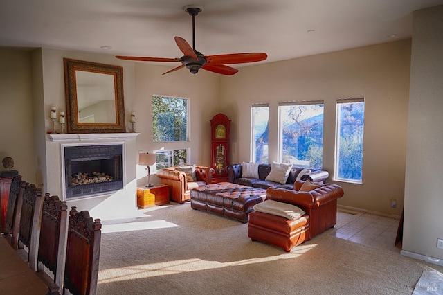 living room with ceiling fan and light colored carpet