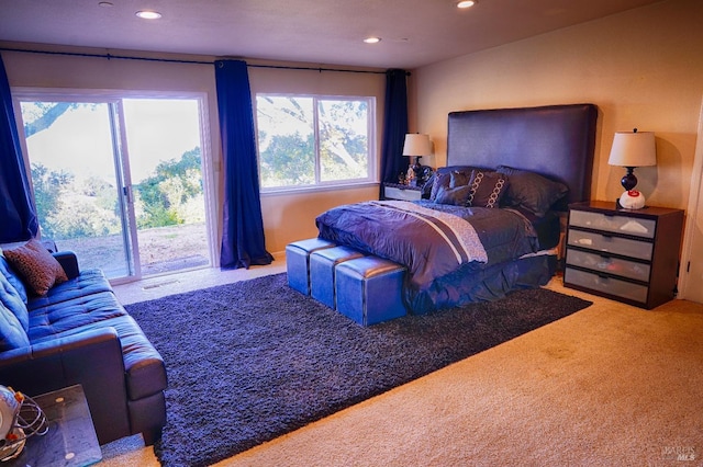 bedroom featuring carpet flooring and access to outside