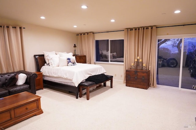 bedroom featuring carpet flooring and access to exterior