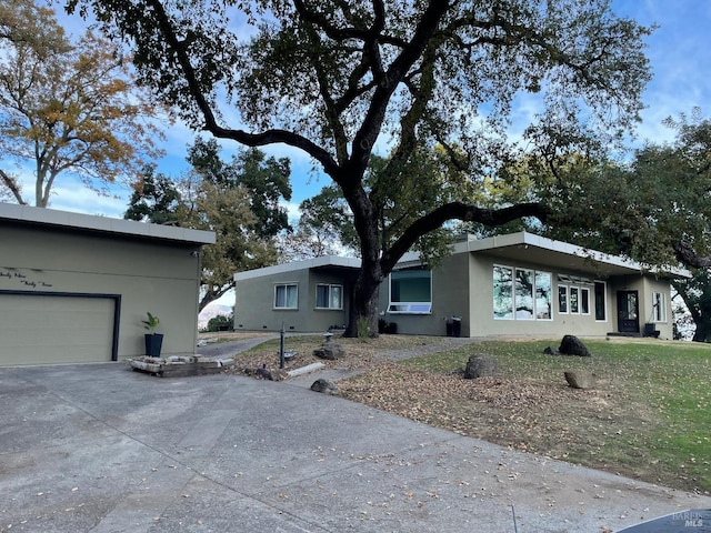 ranch-style home with a garage