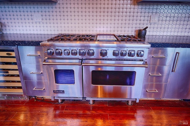 room details with decorative backsplash and range with two ovens