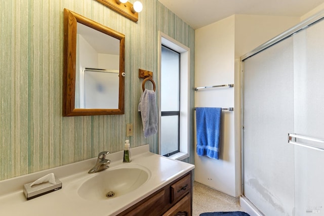 bathroom featuring vanity and walk in shower