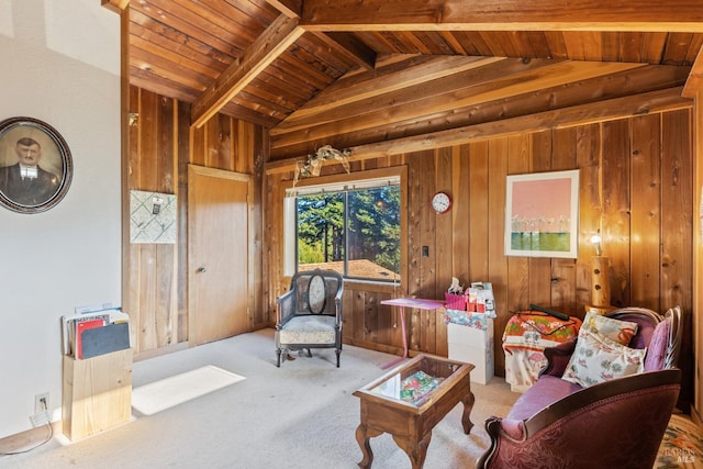 living area featuring lofted ceiling with beams, light colored carpet, wooden ceiling, and wooden walls