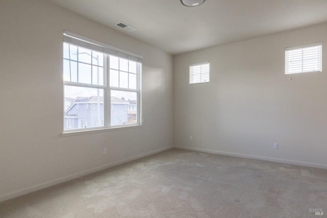 unfurnished room featuring carpet flooring