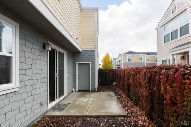 view of property exterior featuring a patio area