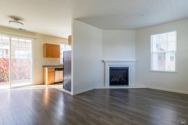 unfurnished living room with light wood-type flooring