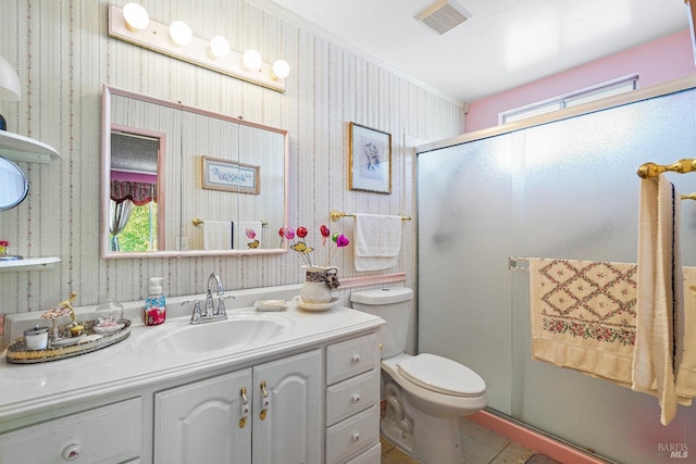 bathroom featuring vanity, toilet, an enclosed shower, and crown molding