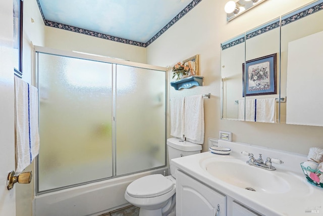 full bathroom featuring vanity, toilet, and enclosed tub / shower combo