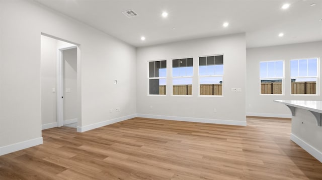 unfurnished living room featuring light wood-type flooring