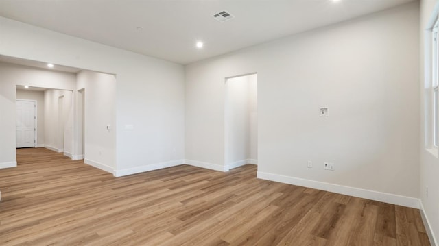 spare room featuring light hardwood / wood-style floors