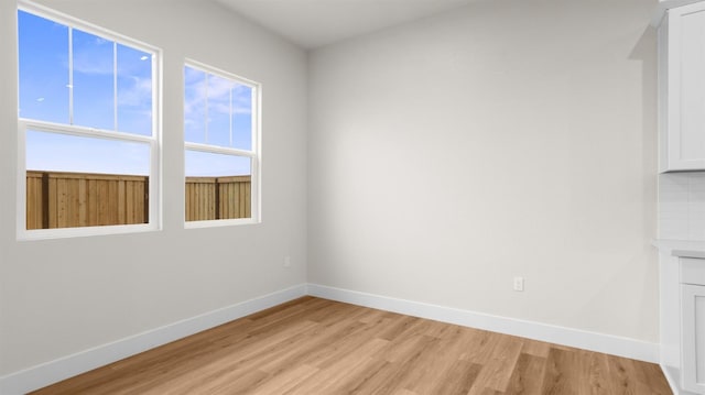 spare room with light hardwood / wood-style floors