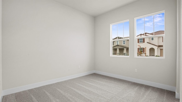 spare room featuring carpet