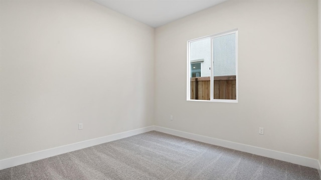 spare room featuring carpet floors