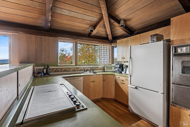 kitchen with white appliances, dark wood-type flooring, sink, vaulted ceiling with beams, and wood ceiling