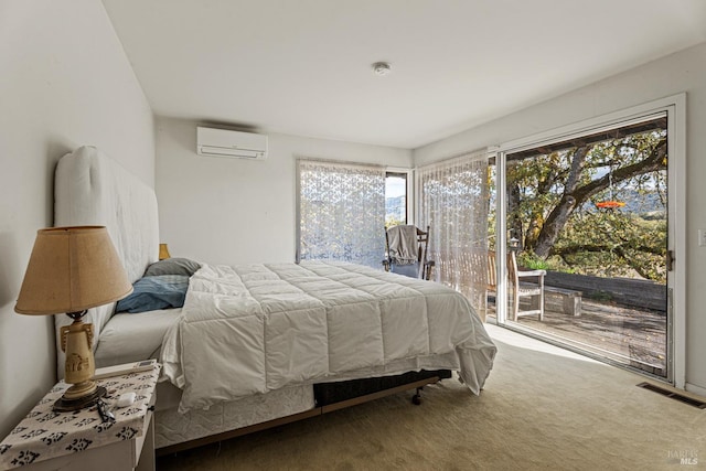 bedroom with a wall unit AC, multiple windows, carpet, and access to exterior