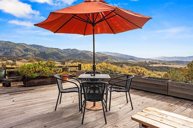 wooden deck featuring a mountain view