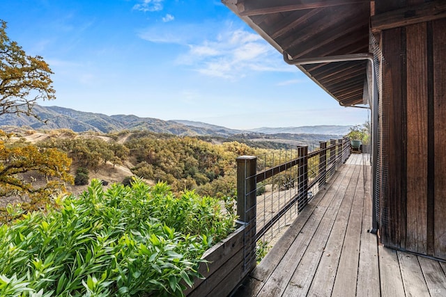 wooden deck featuring a mountain view