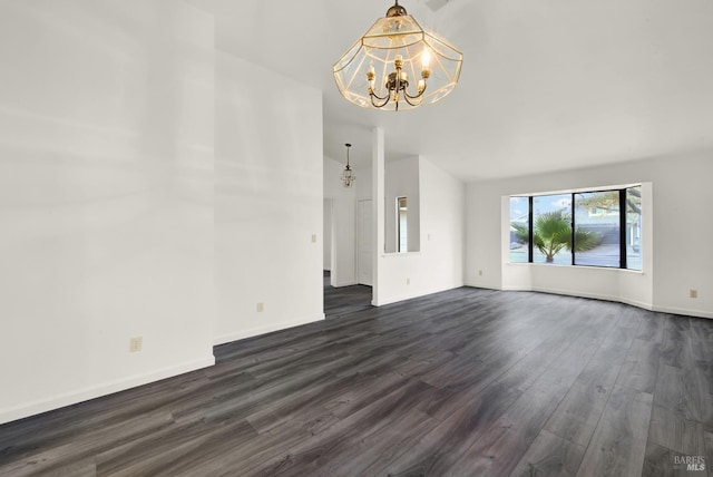 unfurnished living room featuring dark wood-type flooring and a notable chandelier