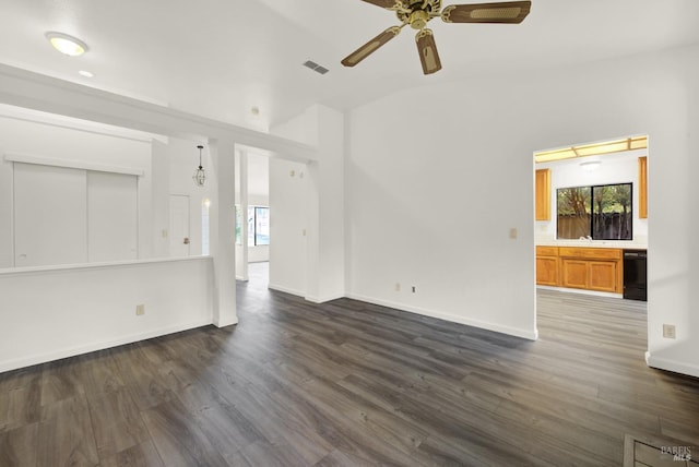 unfurnished living room with ceiling fan, dark hardwood / wood-style flooring, and lofted ceiling