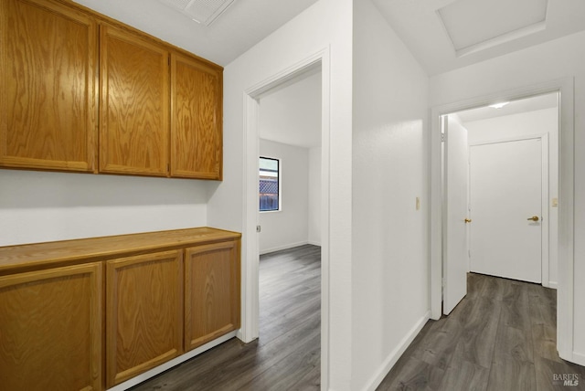 hallway featuring dark wood-type flooring