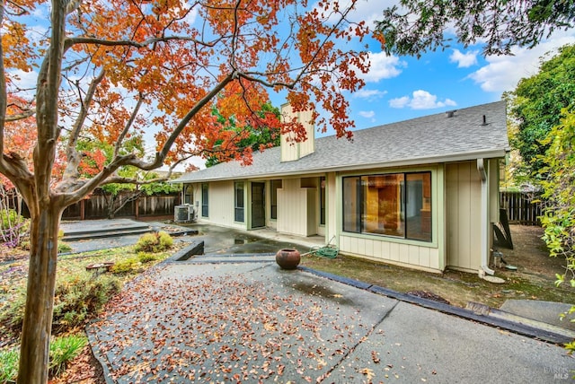 rear view of property featuring a patio and central AC unit