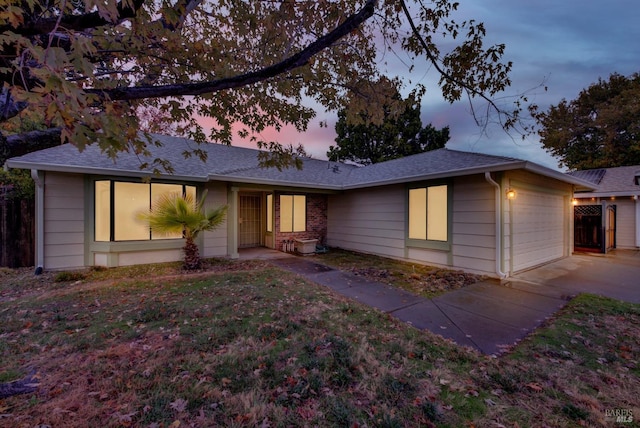 ranch-style house featuring a garage