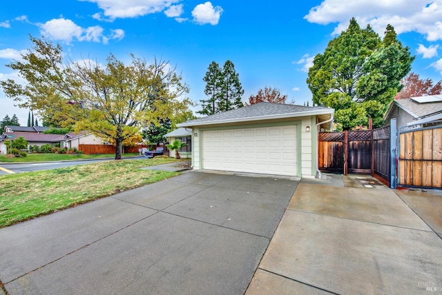 garage featuring a lawn