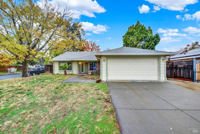 single story home featuring a front yard and a garage