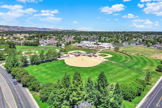 birds eye view of property featuring a mountain view