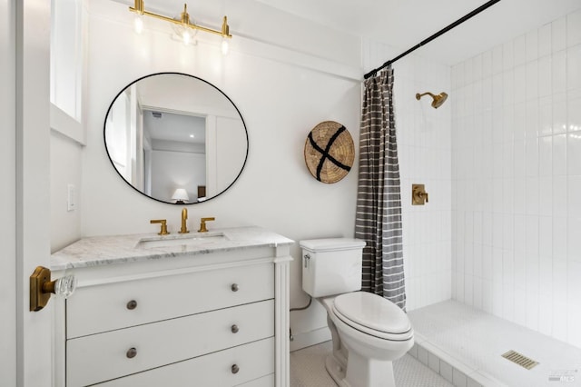 bathroom featuring tile patterned floors, vanity, toilet, and a shower with curtain