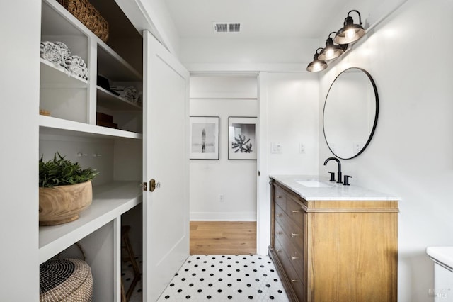 bathroom featuring vanity and hardwood / wood-style flooring