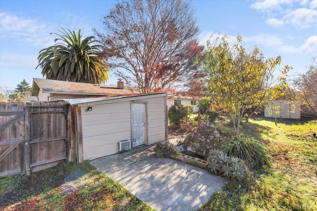 garage featuring a gate and fence