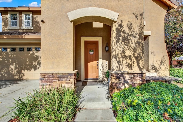 doorway to property featuring a garage