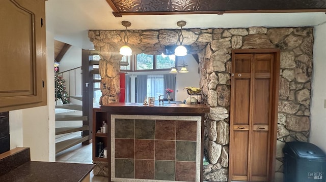 bar featuring decorative light fixtures