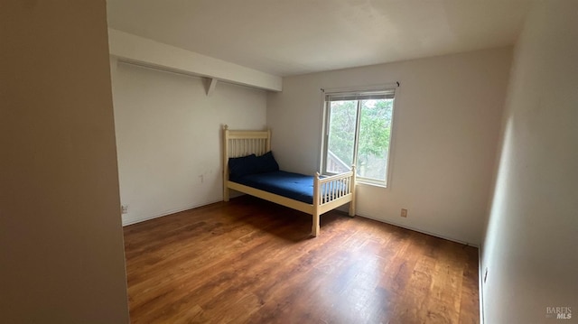 unfurnished bedroom featuring wood-type flooring