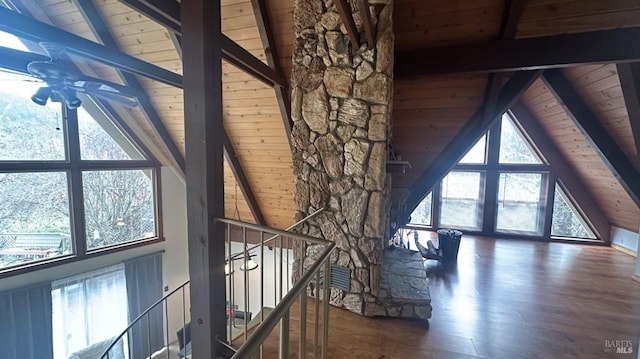 interior space featuring beamed ceiling, dark hardwood / wood-style flooring, and wood ceiling