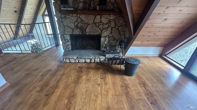 unfurnished living room with hardwood / wood-style flooring and wooden ceiling