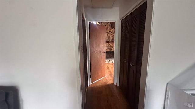 corridor featuring hardwood / wood-style floors