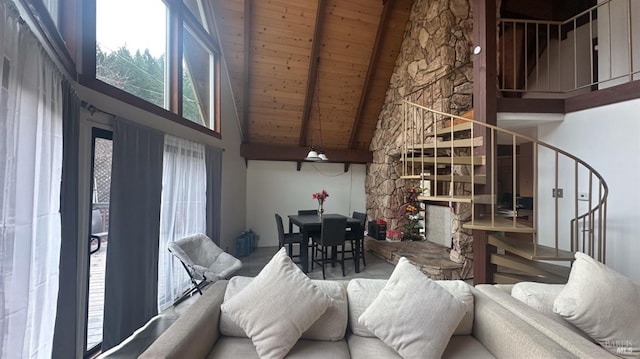 living room with a fireplace, beamed ceiling, high vaulted ceiling, and wood ceiling