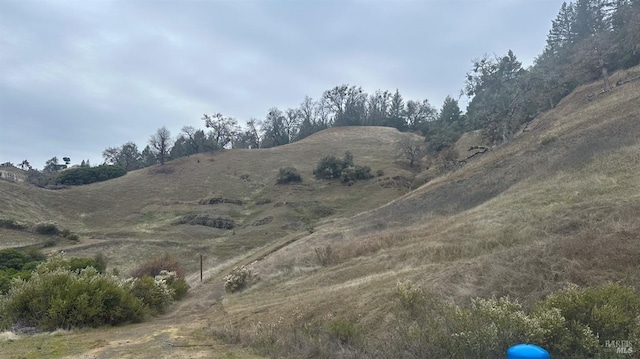 mountain view featuring a rural view